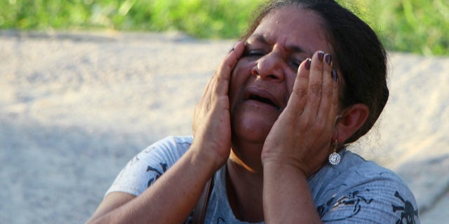 The mother of a prisoner crying outside the Anisio Jobim Prison Complex in Manaus, Brazil, on Monday. (AP Photo/Edmar Barros)