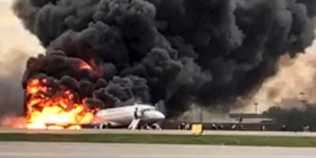 This image taken from a video distributed by Russian Investigative Committee on Sunday, May 5, 2019, shows the Sukhoi SSJ100 aircraft of Aeroflot Airlines on fire, at Sheremetyevo airport, outside Moscow, Russia.