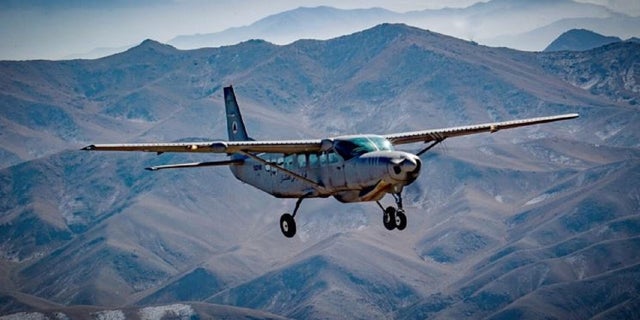 An Afghan pilot conducts training in a C-208 Caravan over Kabul, Afghanistan as part of the Train Advise and Assist Command's mission on Dec. 18, 2018.