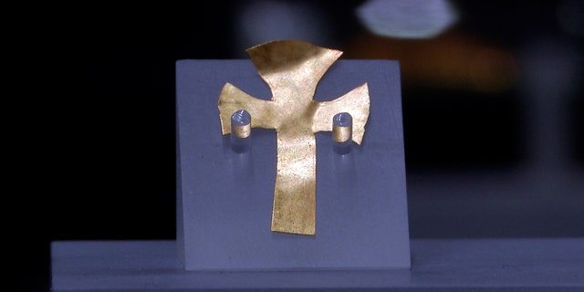 A gold foil cross uncovered at an Anglo-Saxon burial site in the village of Prittlewell in 2003 on display at Southend Central Museum in Southend, England, on May 8, 2019.