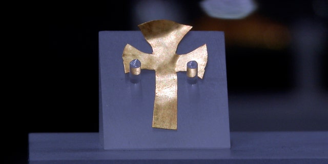 A gold foil cross uncovered at an Anglo-Saxon burial site in the village of Prittlewell in 2003 on display at Southend Central Museum in Southend, England, on May 8, 2019.