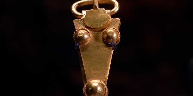 A golden belt buckle uncovered at an Anglo-Saxon burial site in the village of Prittlewell in 2003 on display at Southend Central Museum in Southend, England, Thursday, May 8, 2019.
