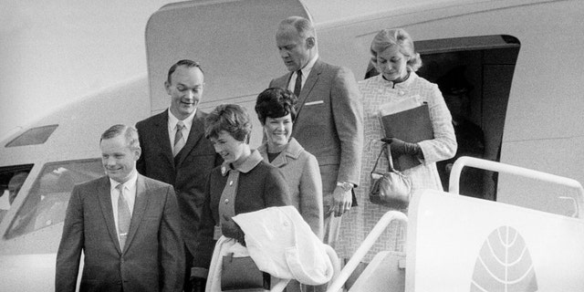 File photo - The Apollo 11 astronauts and their wives leaving the Presidential aircraft at Heathrow Airport in London during their "Giant Leap" global goodwill tour. Neil Armstrong is accompanied by his wife Janet, who can be seen the lunar brooch on her lapel.