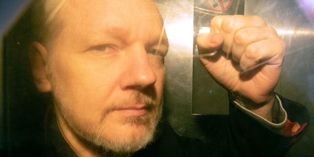 WikiLeaks founder Julian Assange arrives at court in London on May 1, 2019 to be sentenced for bail violation.