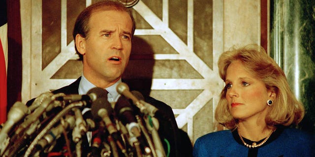 Sen. Joseph Biden Jr., D-Del., holds a news conference in Washington on Sept. 23, 1987, to announce he is withdrawing from the Democratic race for the presidential nomination. Biden's wife, Jill, listens to the announcement. (AP Photo/Ron Edmonds)