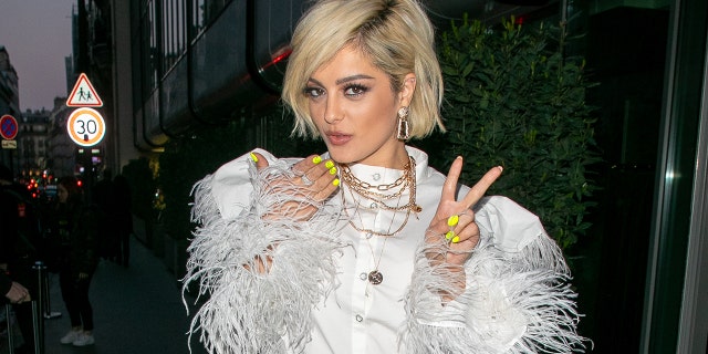 Bebe Rexha says she has previously dated famous women but does not name names.