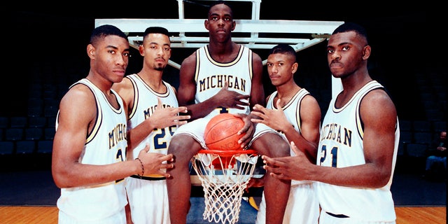 Michigan's Fab Five, from left, Jimmy King, Juwan Howard, Chris Webber, Jalen Rose and Ray Jackson poise in Ann Arbor, Mich. (AP Photo, File)