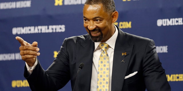 Juwan Howard smiles during his introduction as Michigan's new men's basketball coach, Thursday, May 30, 2019 in Ann Arbor, Mich. (AP Photo/Carlos Osorio)