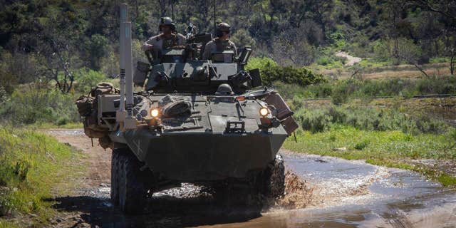 Marines ride on armored vehicle at Camp Pendleton located in North San Diego County, in Southern California.