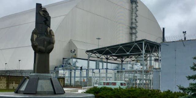 The safe confinement structure surrounding the sarcophagus built around the Chernobyl reactor.