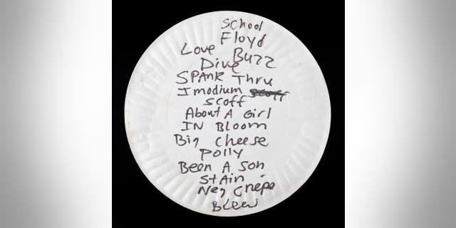 Kurt Cobain reportedly ate pizza off this paper plate in 1990 before he turned it over and wrote this set list on the back in black marker. The plate sold last week for $22,400.