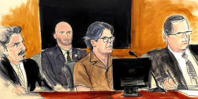 Keith Raniere, center, attending a court hearing in Brooklyn, N.Y., in April 2018. (Elizabeth Williams via AP, File)