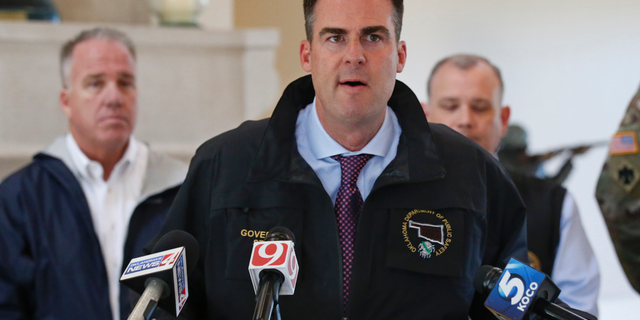 Oklahoma Gov. Kevin Stitt talks with the media following an aerial tour of tornado- and flood-damaged areas of the state, Tuesday, May 21, 2019, in Oklahoma City. (AP Photo/Sue Ogrocki)