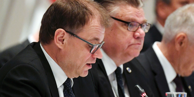 Finnish Prime Minister Juha Sipil', left, and Foreign Minister Timo Soini attend at the Ministers for Foreign Affairs of the Council of Europe's annual meeting in Helsinki, Finland Friday, May 17, 2019. (Vesa Moilanen/Lehtikuva via AP)