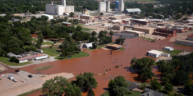 Flooding in Kingfisher, Okla. is pictured Tuesday, May 21, 2019. Flooding following heavy rains was an issue across the state. (AP Photo/Sue Ogrocki)