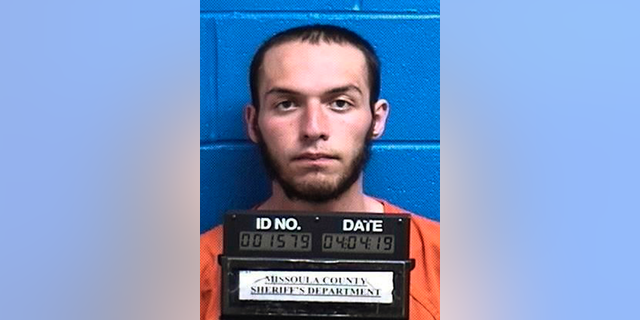 FILE - This April 4, 2019, file photo released by the Missoula County Sheriff's Office shows Fabjan Alameti, 21. Alameti, who federal agents say talked about joining an Islamic State group and attacking random people to avenge a shooting at two New Zealand mosques, has been ordered held in custody pending his June 24 trial in Montana. A U.S magistrate judge ruled Alameti, who has pleaded not guilty to possession of a firearm by an unlawful user of a controlled substance and making false statements involving international and domestic terrorism, poses too great a threat to the community to return to his mother's apartment in the Bronx. (Missoula County Sheriff's Office via AP, File)