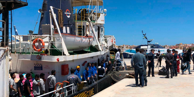 Rescued migrants desembark from the Mare Jonio rescue ship of the Italian NGO Mediterranea Saving Humans as it docked at the port of the Italian island of Lampedusa, southern Italy, Friday, May 10, 2019. According to Mediterranea Saving Humans, some 30 migrants, including two pregnant women and a small child, were rescued a day earlier off the Libyan coast. (Elio Desiderio/ANSA via AP)