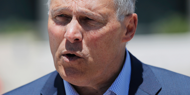 Democratic Presidential candidate Washington Gov. Jay Inslee participates in a climate change rally Friday, May 24, 2019, in Las Vegas. (AP Photo/John Locher)