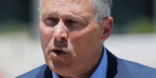 Democratic Presidential candidate Washington Gov. Jay Inslee participates in a climate change rally Friday, May 24, 2019, in Las Vegas. (AP Photo/John Locher)