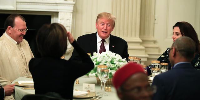President Donald Trump joins an iftar dinner, which breaks a daylong fast, celebrating Islam's holy month of Ramadan, in the State Dining Room of the White House in Washington, Monday, May 13, 2019. (AP Photo/Manuel Balce Ceneta)