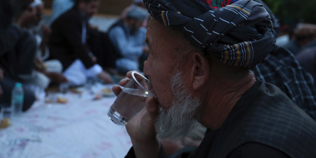 Afghans break their fast during the holy month of Ramadan, in Kabul, Afghanistan, Sunday, May 12, 2019. Muslims throughout the world are celebrating Ramadan, the holiest month in the Islamic calendar, refraining from eating, drinking, smoking and sex from sunrise to sunset. (AP Photo/Rahmat Gul)