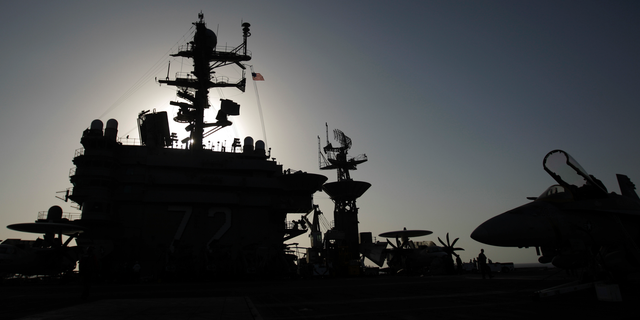 FILE - This Feb. 14, 2012, file photo shows the bridge of the Nimitz-class aircraft carrier USS Abraham Lincoln (CVN 72). The U.S. is dispatching the USS Abraham Lincoln and other military resources to the Middle East following “clear indications” that Iran and its proxy forces were preparing to possibly attack U.S. forces in the region, according to a defense official on May 5, 2019. (AP Photo/Hassan Ammar, File)
