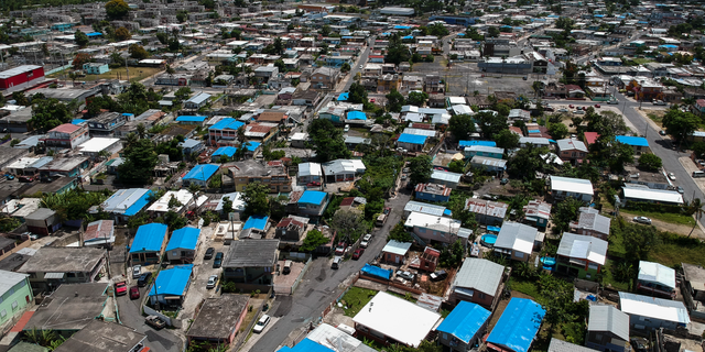 This June 18, 2018, file photo shows an aerial view of the Amelia neighborhood in the municipality of Catano, east of San Juan, Puerto Rico. The House has passed a $19 billion disaster aid bill that would deliver long-sought relief to farmers, victims of hurricanes and floods, and rebuild southern military bases. Democrats controlling the chamber are trying to dislodge the legislation from a Senate logjam over aid to hurricane-slammed Puerto Rico. (AP Photo/Dennis M. Rivera, File)