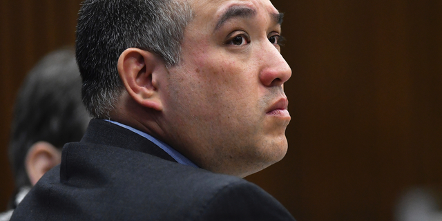 FILE - In this April 10, 2019, file photo, former Michigan state Trooper Mark Bessner listens to Assistant Wayne County Prosecutor Matthew Penney deliver his opening statement in Bessner's trial, in Detroit. Bessner is facing a prison sentence for involuntary manslaughter for firing a Taser at a Detroit teenager who crashed an all-terrain vehicle and died. He's scheduled to return to court, Monday, May 13 for his sentence. (Clarence Tabb Jr./Detroit News via AP, File)