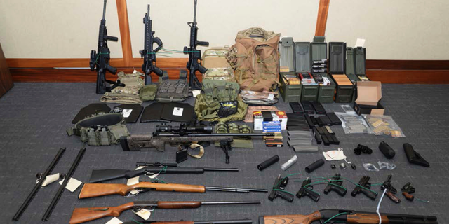 Investigators removed this cache of guns and ammunition from Hasson's Silver Spring, Md. apartment after his arrest in February. (U.S. District Court via AP, File)