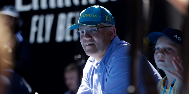 FILE - In this Jan 20, 2019, file photo, Australian Prime Minister Scott Morrison watches the fourth round match between Australia's Ashleigh Barty and Russia's Maria Sharapova on Rod Laver Arena at the Australian Open tennis championships in Melbourne, Australia. Saturday, May 18, 2019 is the last possible date that Morrison could have realistically chosen to hold an election. (AP Photo/Mark Schiefelbein, File)