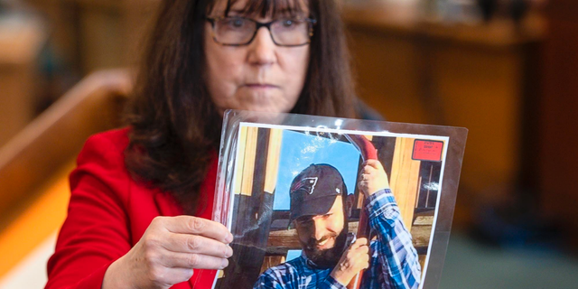 Prosecutor Susan Hardin shows a picture of Steven Bourgoin as he appeared in 2016 during his murder trial in Vermont Superior Court in Burlington on Monday, May 6, 2019. Bourgoin is facing five counts of second-degree murder for a crash that killed five teenagers on I-89 in Williston in 2016. (Glenn Russell/The Burlington Free Press via AP, Pool)