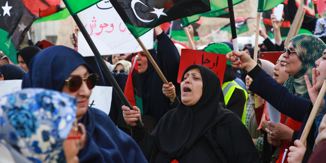 Libyans hold a demonstration at Martyrs' Square against military operations by forces loyal to Field Marshal Khalifa Hifter in Tripoli, Libya, Friday, May 3, 2019. (AP Photo/Hazem Ahmed)
