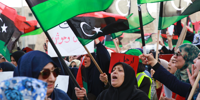 Libyans hold a demonstration at Martyrs' Square against military operations by forces loyal to Field Marshal Khalifa Hifter in Tripoli, Libya, Friday, May 3, 2019. (AP Photo/Hazem Ahmed)