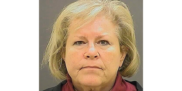 FILE - This undated file photo provided by the Baltimore Police Department shows former Episcopal Bishop Heather Cook. Cook, who fatally struck a bicyclist while drunk and texting behind the wheel more than four years ago, has been released from a Maryland prison. She was the second-highest-ranking Episcopal leader in the mid-Atlantic state when the fatal Baltimore crash occurred two days after Christmas 2014. Her lawyer says she was released Tuesday, May 14, 2019, from the Maryland Correctional Institute for Women. (Baltimore Police Department via AP, File)