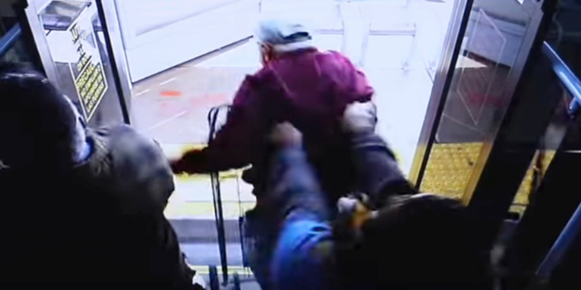 In this still image taken from security video and provided by the Las Vegas Metropolitan Police Department, a woman shoves a 74-year-old man off a public transit bus on March 21, 2019. The man, Serge Fournier, hit his head on the sidewalk and died a month later. The Clark County coroner ruled his death a homicide resulting from his injuries. Cadesha Michelle Bishop was arrested Monday, May 13, 2019, and is scheduled to appear in court on May 21. (Las Vegas Metropolitan Police Department via AP)