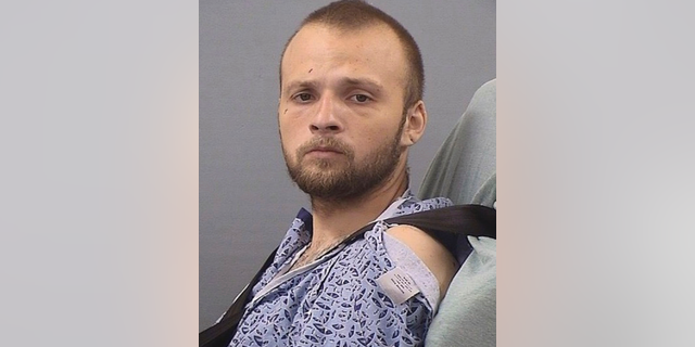 This Friday, May 10, 2019, photo provided by the Tennessee Bureau of Investigation shows Michael Cummins. Cummins, 25, has been charged in connection to the murder of at least seven people at two different locations in Sumner County, Tenn., on April 27. Cummins was charged May 10 after being released from a hospital. Cummins was shot during his arrest. (Tennessee Bureau of Investigation via AP)