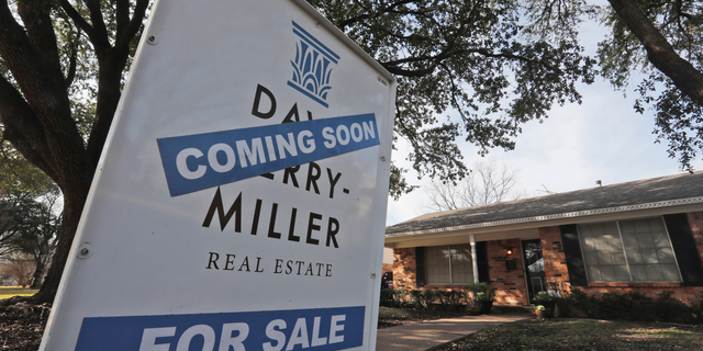 FILE- In this Feb. 20, 2019, file photo a coming soon for sale sign sits in front of a home in the Dallas suburb of Richardson, Texas. On Thursday, May 2, Freddie Mac reports on this week’s average U.S. mortgage rates. (AP Photo/LM Otero, File)