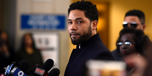 In this March 26, 2019 file photo, Actor Jussie Smollett talks to the media before leaving Cook County Court after his charges were dropped, in Chicago. He now faces new charges following an investigation.