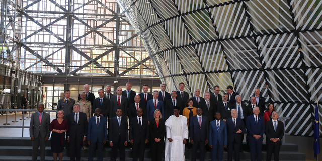 European Union foreign policy chief Federica Mogherini, front row center, poses along with ministers for a group photo after an EU Foreign and Defense Ministers meeting with their counterparts of the G5 Sahel countries at the European Council headquarters in Brussels, Tuesday, May 14, 2019. (AP Photo/Francisco Seco)