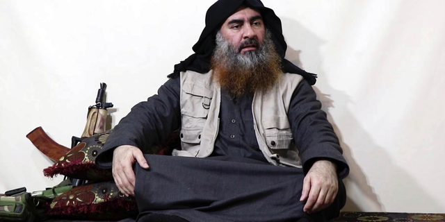 This file image made from video posted on a militant website Monday, April 29, 2019, purports to show the leader of the Islamic State group, Abu Bakr al-Baghdadi, being interviewed by his group's Al-Furqan media outlet. No longer burdened by territory and administration, Islamic State group leader Abu Bakr al-Baghdadi outlined the new path forward for his group: Widen your reach, connect with far-flung militant groups and exhaust your enemies with a “war of attrition.” (Al-Furqan media via AP, File)
