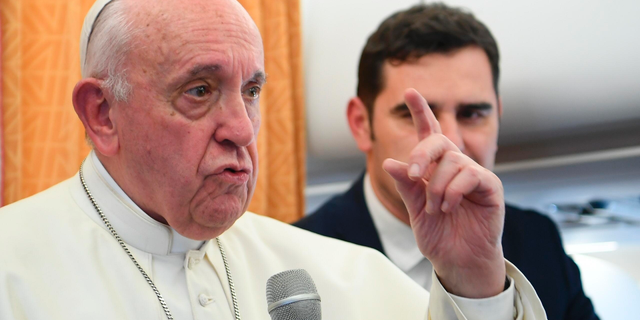 Pope Francis talks to reporters on his flight back to Rome, Tuesday, May 7, 2019. Francis made the first-ever papal visit to North Macedonia on Tuesday and sought to encourage its efforts to integrate into European institutions after its name change resolved a decades-long dispute with Greece. (Maurizio Brambatti/Pool Photo via AP)
