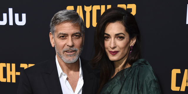 George Clooney and Amal Clooney arrive at the Los Angeles premiere of 