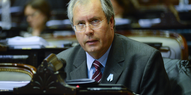FILE - In this May 18, 2016 file photo provided by the Nation's Honorable Chamber of Deputies, lawmaker Hector Olivares attends a congressional commission session in Buenos Aires, Argentina. Argentine Senate President Federico Pinedo confirmed on May 12, 2019 that Olivares died after he was seriously injured in a May 9 shooting near the congressional building in Buenos Aires. (Nation's Honorable Chamber of Deputies, HCDN via AP, File)
