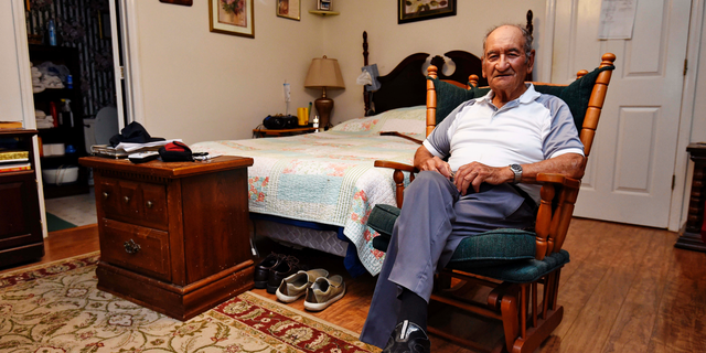 In this May, 21, 2019, photo, Dennis Trudeau, a World War II veteran who landed in Normandy on D-Day, poses for a photo at his home in Grovetown, Ga. Trudeau had joined the Canadian military at 17 and became a paratrooper in part because they paid an extra $50 a month. (AP Photo/Richard Shiro)