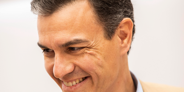 Spain's Prime Minister Pedro Sanchez smiles during a party meeting at Socialist party headquarters in Madrid, Spain, Monday, April 29, 2019. Spain's political future is no clearer after a third election since 2015, with experts saying Monday that it won't be anytime soon before the muddle is resolved. The incumbent prime minister, Pedro Sanchez, celebrated after his Socialist party won the most votes in Sunday's ballot. But Spanish politicians were doing the math on how Sanchez might survive the next four years without a parliamentary majority. (AP Photo/Bernat Armangue)