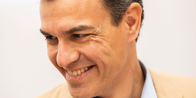 Spain's Prime Minister Pedro Sanchez smiles during a party meeting at Socialist party headquarters in Madrid, Spain, Monday, April 29, 2019. Spain's political future is no clearer after a third election since 2015, with experts saying Monday that it won't be anytime soon before the muddle is resolved. The incumbent prime minister, Pedro Sanchez, celebrated after his Socialist party won the most votes in Sunday's ballot. But Spanish politicians were doing the math on how Sanchez might survive the next four years without a parliamentary majority. (AP Photo/Bernat Armangue)