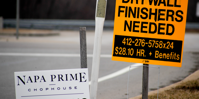 In this March 1, 2019, photo signs for employment opportunities are posted at an exit ramp off of Interstate 79 in Zelienople, Pa. On Tuesday, May 7, the Labor Department reports on job openings and labor turnover for March. (AP Photo/Keith Srakocic)