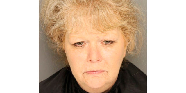 This undated photo provided by the Greenville County Jail shows Brook Graham. Authorities say Graham, a mother already facing a murder charge for abandoning her baby daughter in 1990, is now charged with dumping the body of her infant son nearly a year earlier. (Greenville County Jail via AP)