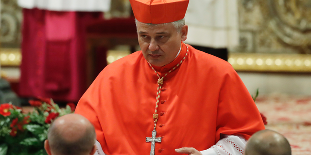 FILE - In this Thursday, June 28, 2018 filer, Cardinal Konrad Krajewski right after being elected in a consistory in St. Peter's Basilica at the Vatican. Pope Francis' almsgiver has gone down a Rome manhole to restore electricity for hundreds of homeless people living in an unused state-owned building. Polish Cardinal Konrad Krajewski told Italian news agency ANSA he went underground and flipped a power switch Saturday in a "desperate gesture" to help the building's more than 400 occupants . (AP Photo/Alessandra Tarantino, File)