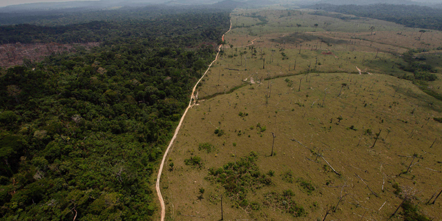 FILE - This Sept. 15, 2009 file photo shows a deforested area near Novo Progresso in Brazil's northern state of Para. The Bolsonaro administration in Brazil has cancelled a United Nations climate change workshop to be held in the city of Salvador in August 2019, reaffirming its lack of interest in participating in international efforts to fight global warming. (AP Photo/Andre Penner, File)